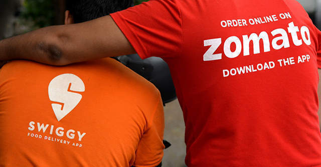 Two smartphones showing Zomato and Swiggy apps